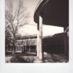 Black and white Polaroid of part of a building