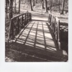 Black and white Polaroid of a bridge